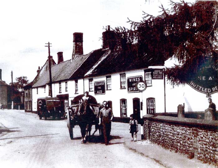 The Blue Boar Inn in the early 1900s with horse and cart, Bullard's Fine Ales sign