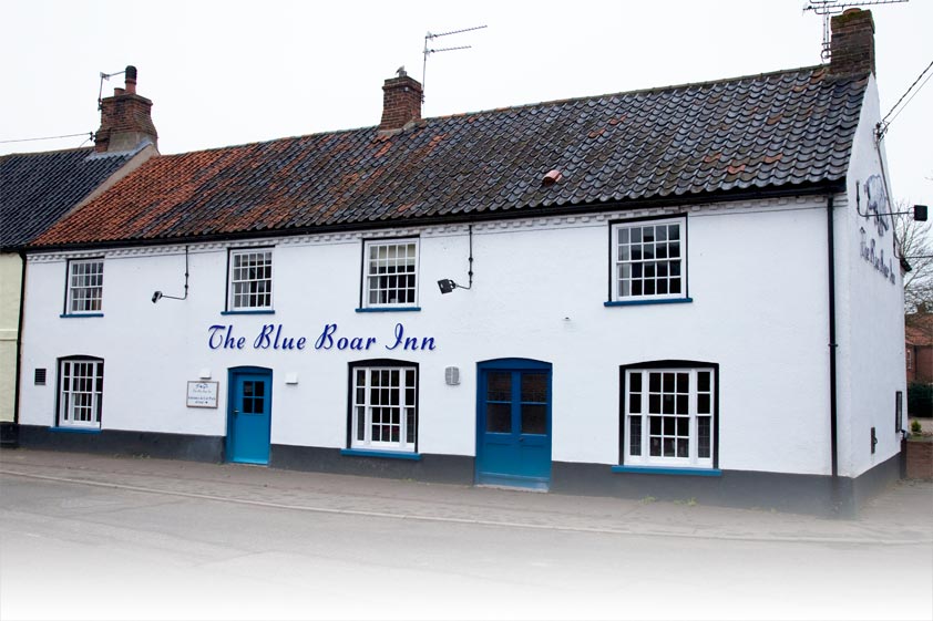 The Blue Boar Inn today, white-painted with characteristic blue woodwork