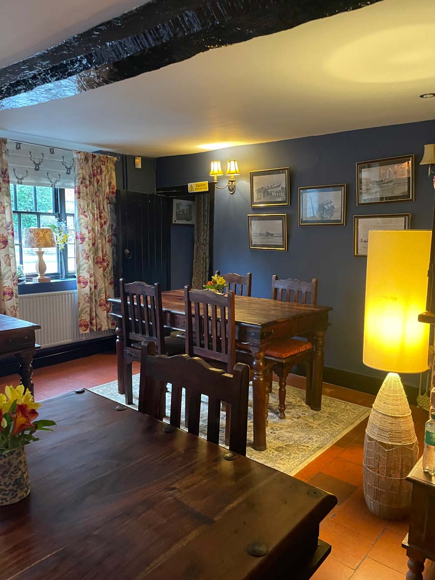 The brick floored stable restaurant at The Blue Boar Inn