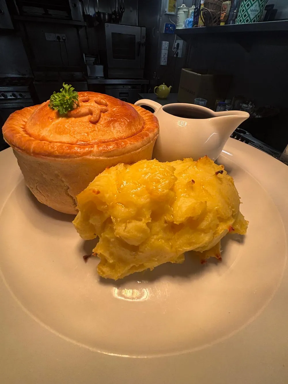 Homemade beef and ale pie with cheesy mash and gravy